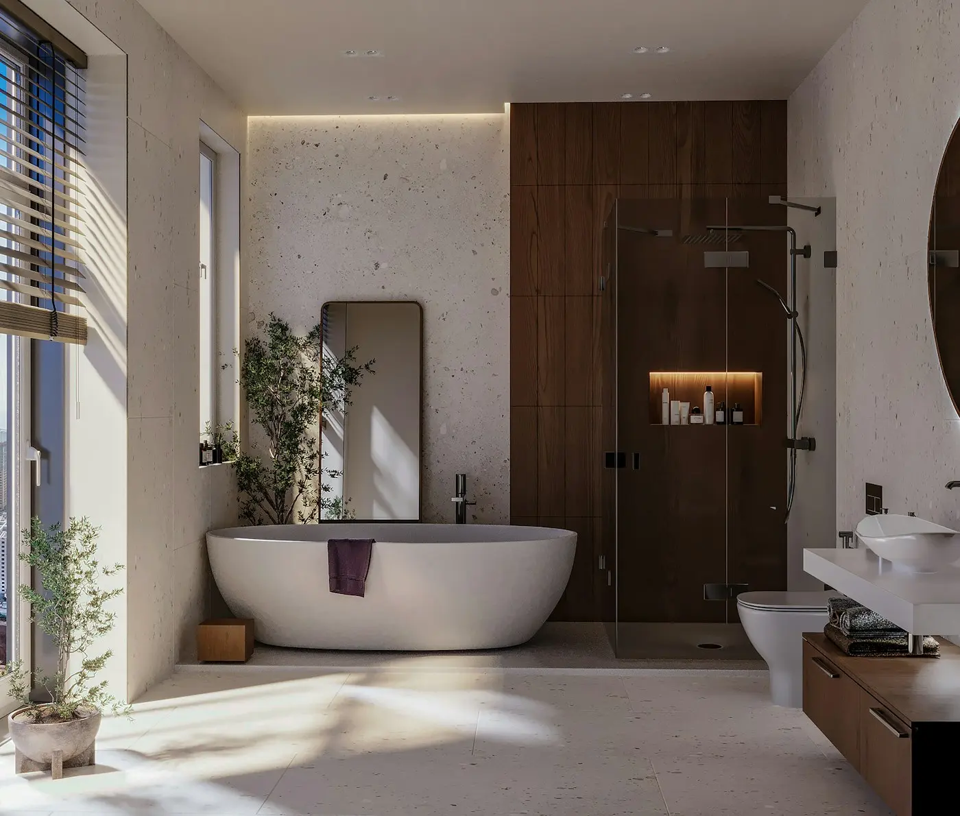 Salle de bain rénovée avec baignoire îlot et douche vitrée